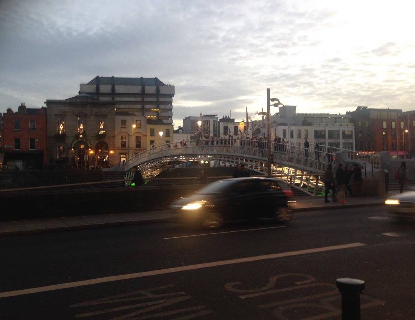 Ha'penny Bridge over the River Liffey at dusk in Dublin.
