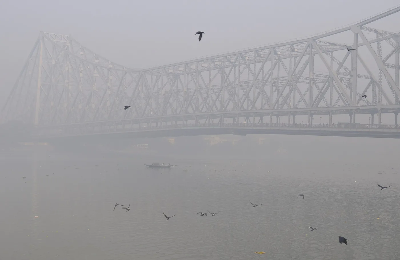 Howrah Bridge rising through morning haze in Kolkata