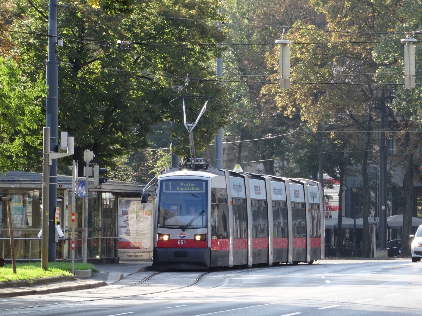 Red-and-white Wiener Linien tram on the Ringstrasse at Burgring in Vienna